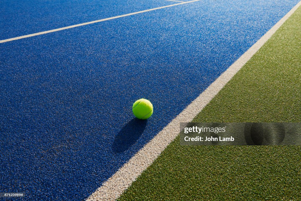 Tennis  ball and net shadow