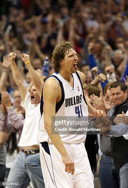 Forward Dirk Nowtizki of the Dallas Mavericks reacts after scoring to take a two-point lead against the Denver Nuggets in Game Four of the Western...
