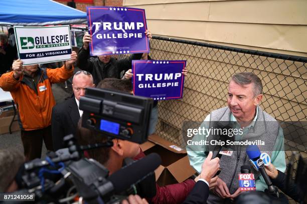 Republican candidate for Virginia governor Ed Gillespie talks to journalists after casting his vote at the polling place at Washington Mill...