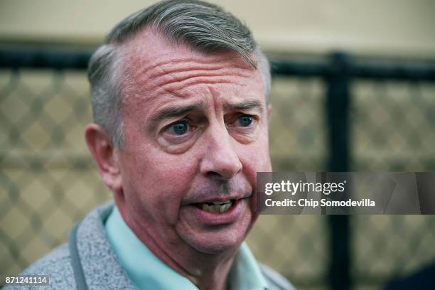 Republican candidate for Virginia governor Ed Gillespie talks to journalists after casting his vote at the polling place at Washington Mill...