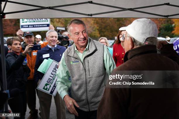 Republican candidate for Virginia governor Ed Gillespie talks with campaign volunteers as he arrives to cast his vote at Washington Mill Elementary...