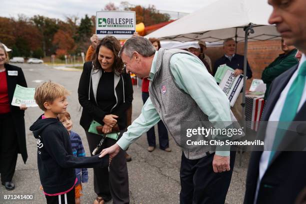 After casting his vote, Republican candidate for Virginia governor Ed Gillespie greets people outside Washington Mill Elementary School November 7,...