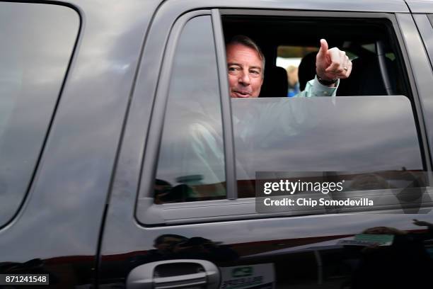 After casting his vote, Republican candidate for Virginia governor Ed Gillespie gives supporters a thumbs-up as he leaves Washington Mill Elementary...