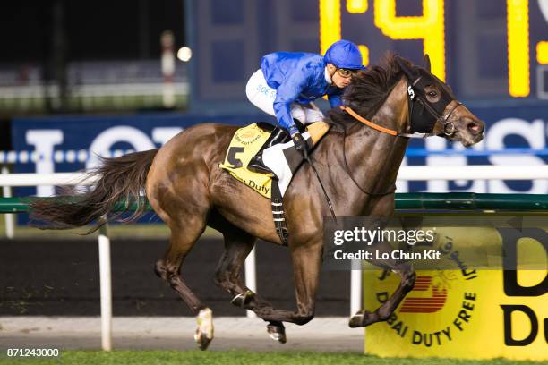 Silvestre De Sousa riding Sajjhaa wins Dubai Duty Free during the Dubai World Cup race day at the Meydan Racecourse on March 30, 2013 in Dubai,...