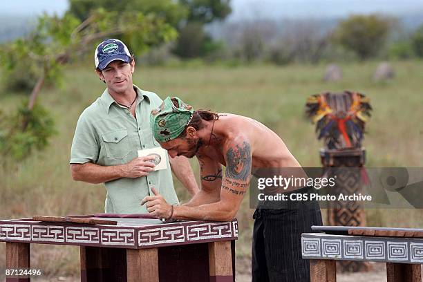 Jeff Prost looks on as Benjamin "Coach" Wade, competes during the immunity challenge "Propellerheads" during the twelfth episode of SURVIVOR:...