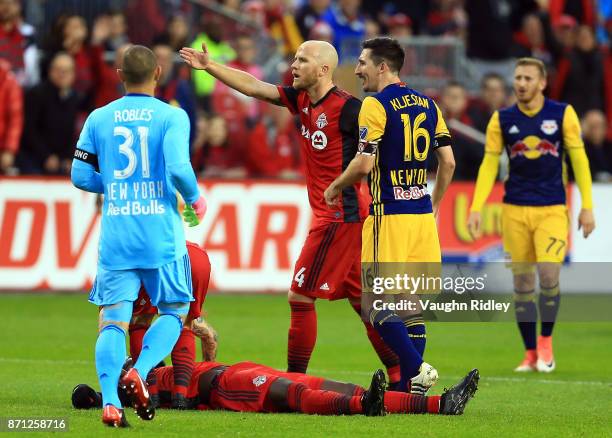 Michael Bradley of Toronto FC gestures to the referee after teammate Jozy Altidore is knocked down by Sacha Kljestan of New York Red Bulls during the...