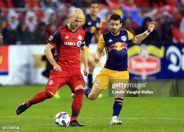 Michael Bradley of Toronto FC passes the ball during the second half of the MLS Eastern Conference Semifinal, Leg 2 game against New York Red Bulls...