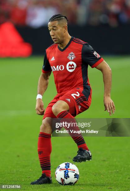 Justin Morrow of Toronto FC dribbles the ball during the first half of the MLS Eastern Conference Semifinal, Leg 2 game against New York Red Bulls at...