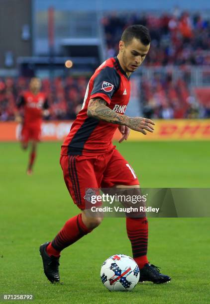 Sebastian Giovinco of Toronto FC dribbles the ball during the first half of the MLS Eastern Conference Semifinal, Leg 2 game against New York Red...