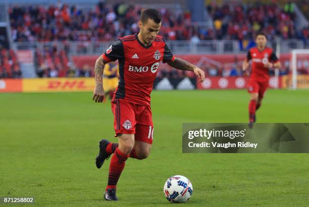 Sebastian Giovinco of Toronto FC dribbles the ball during the first half of the MLS Eastern Conference Semifinal, Leg 2 game against New York Red...