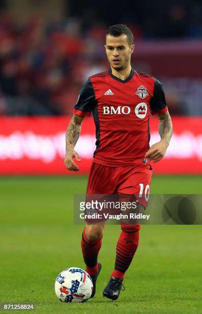 Sebastian Giovinco of Toronto FC dribbles the ball during the first half of the MLS Eastern Conference Semifinal, Leg 2 game against New York Red...