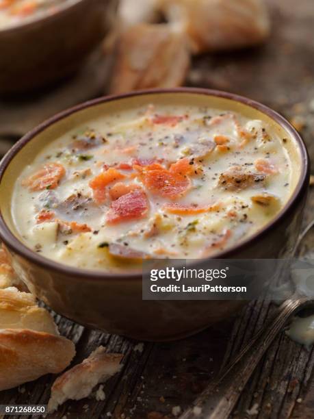 creamy bacon and potato soup with bread sticks - chowder stock pictures, royalty-free photos & images