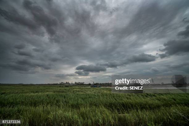 industry landscape - ominous sky stock pictures, royalty-free photos & images