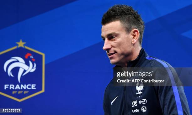 France's defender Laurent Koscielny arrives for a press conference in Clairefontaine-en-Yvelines near Paris on November 7, 2017 as part of the France...