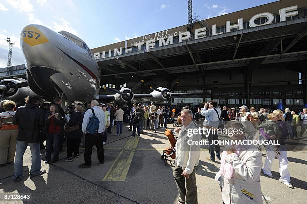 Members of the public take to the tarmac at Tempelhof airport in Berlin May 12 to commemorated the 60th anniversary of the end of the airlift during...