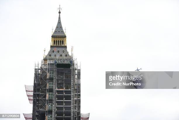 One of the clocks of the Elizabeth Tower, commonly known as Big Ben, is seen through the scaffolding that entirely cover it, London on November 7,...