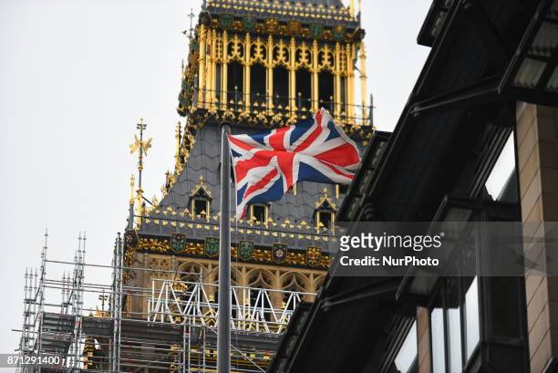 One of the clocks of the Elizabeth Tower, commonly known as Big Ben, is seen through the scaffolding that entirely cover it, London on November 7,...