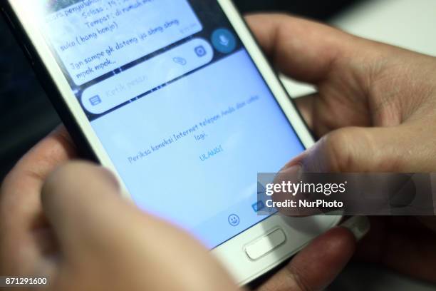 Users try to use the Gif content feature in the Whatsapp chat app that can not be accessed, on Tuesday, November 7, 2017. The Government of Indonesia...