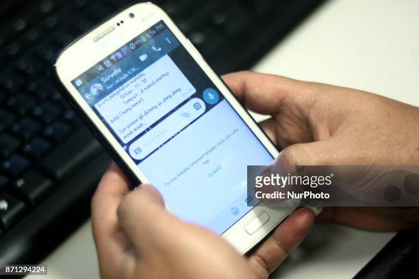 Users try to use the Gif content feature in the Whatsapp chat app that can not be accessed, on Tuesday, November 7, 2017. The Government of Indonesia...