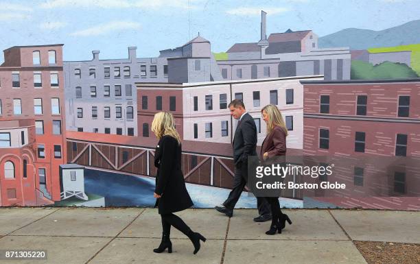 After voting at the Lower Mills Branch of the Boston Public Library, Mayor Martin J. Walsh heads up Richmond Street with his partner Lorrie Higgins,...