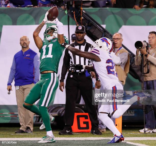 Robby Anderson of the New York Jets pulls in a pass for a touchdown in the third quarter in front of Tre'Davious White of the Buffalo Bills in an NFL...