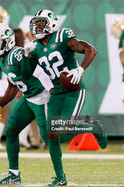 Juston Burris of the New York Jets runs with the ball after recovering it in an NFL football game against the Buffalo Bills on November 2, 2017 at...