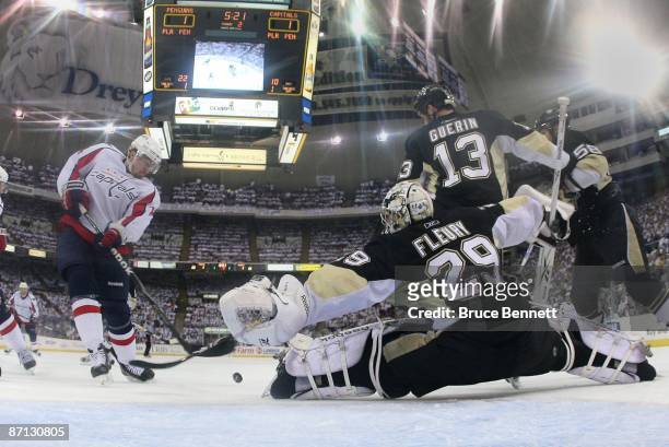 Tomas Fleischmann of the Washington Capitals scores a second period goal against Marc-Andre Fleury of the Pittsburgh Penguins during Game Six of the...