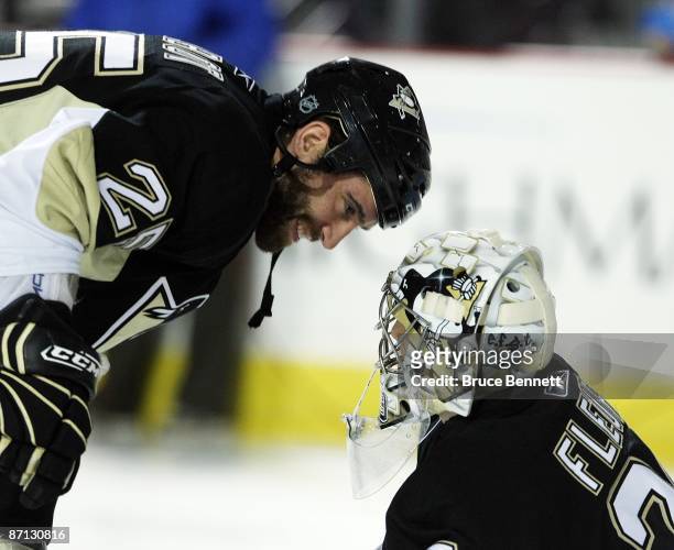 Maxime Talbot of the Pittsburgh Penguins talks to goaltender Marc-Andre Fleury prior to their game against the Washington Capitals of during Game Six...