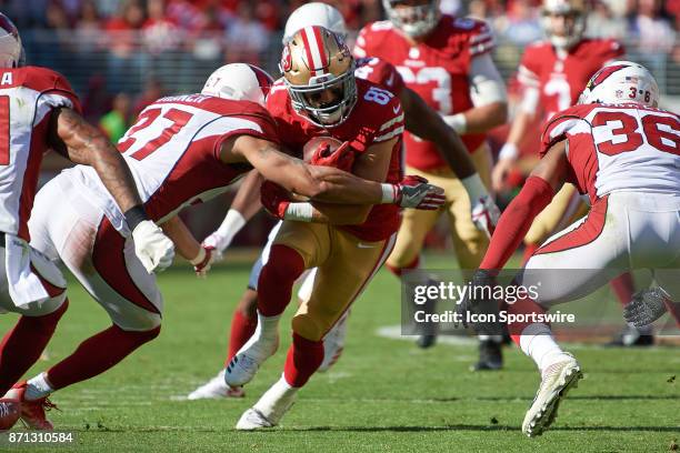 San Francisco 49ers wide receiver Trent Taylor battles with Arizona Cardinals strong safety Tyvon Branch and Arizona Cardinals safety Budda Baker...