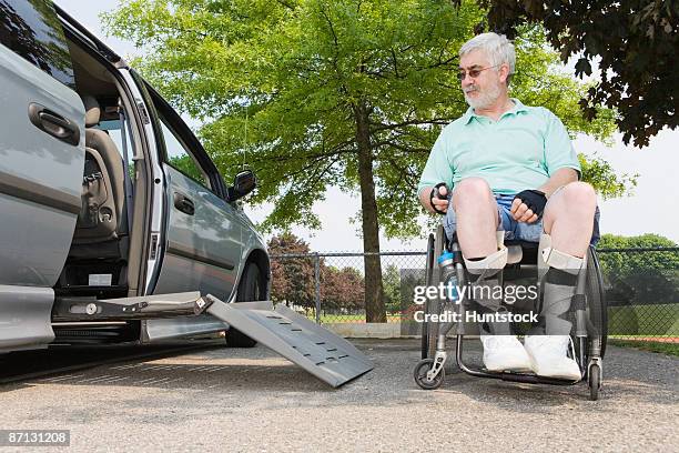 view of a handicapped man near his accessible van - acceso para sillas de ruedas fotografías e imágenes de stock