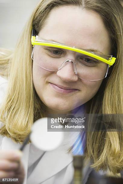 female scientist checking out membrane filter for bacteria  - filtro de membrana imagens e fotografias de stock