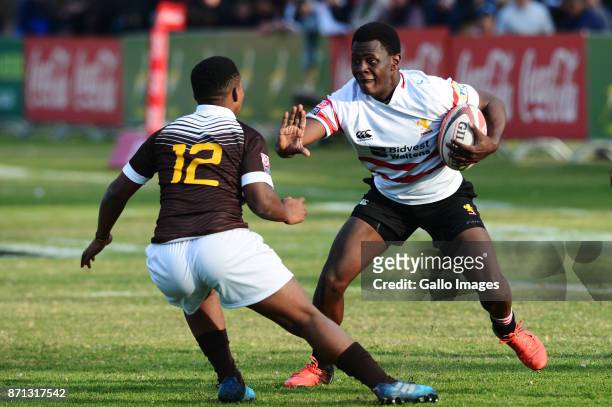 Yanga Hlalu of the Golden Lions tackled by Sinethemba Qeshile of Border during the match betyween the Golden Lions and Border on day 1 of the 2017...