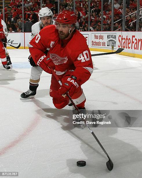 Henrik Zetterberg of the Detroit Red Wings skates in front of Petteri Nokelainen of the Anaheim Ducks during Game Five of the Western Conference...