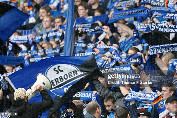 Supporters of Paderborn cheer their team during the 3. Liga match between SC Paderborn and Werder Bremen II at the Paragon Arena on May 12, 2009 in...