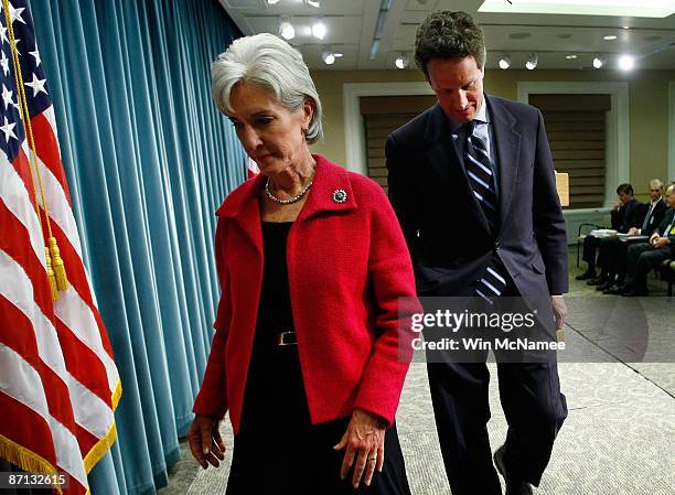 Treasury Secretary Timothy Geithner and Secretary of Health and Human Services Kathleen Sebelius depart following a press conference at the Treasury...