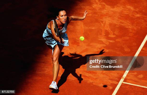 Jelena Jankovic of Serbia stretches for a forehand against Daniela Hantuchova of Slovakia in their second round match during the Madrid Open tennis...