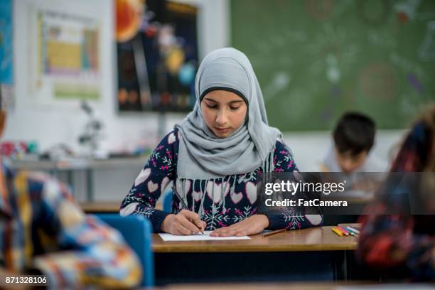 writing class - headscarf stock pictures, royalty-free photos & images