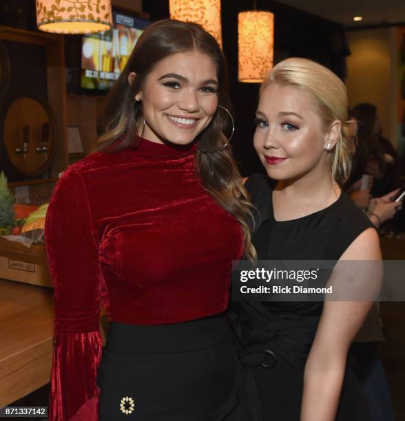 Singer-songwriter Abby Anderson and co-host RaeLynn take photos before the 2017 CMT Next Women Of Country Celebration at City Winery Nashville on...