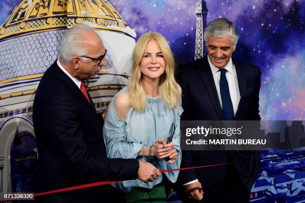 Australian actress Nicole Kidman is about to cut the ribbon next to President and CEO of Le Printemps Paolo De Cesare and LVMH Group Managing...