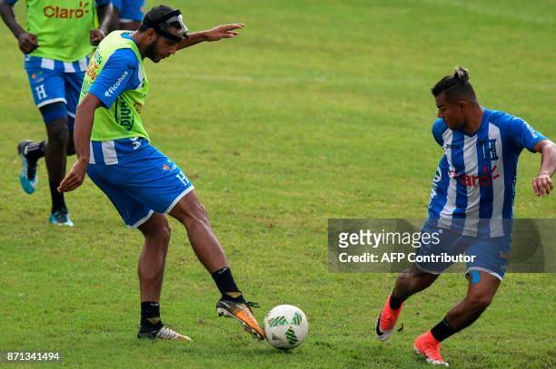 Honduras' players Eddy Hernandez and Mario Martinez take part in a training session in San Pedro Sula, Honduras, on November 7, 2017 just days ahead...