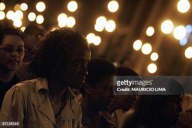 Locals attend the presentation of outfits by Afro-Brazilian people during a demonstration against discrimination of Afro-Brazilian models on fashion...