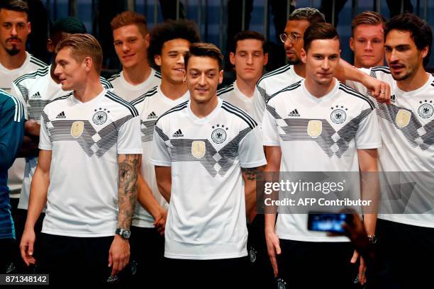 German national football team's members, midfielder Toni Kroos , midfielder Mesut Ozil , midfielder Julian Draxler , defender Mats Hummels and...