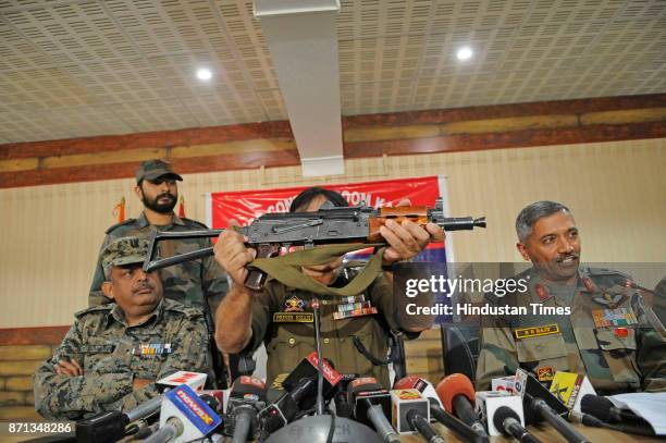 Inspector General of Police Muneer Khan displays AK47 Draco Russian made rifle during a joint press conference with Army and CRPF on November 7, 2017...