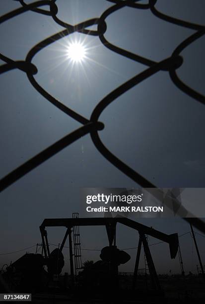 Oil pumps at work on an oilfield in Los Angeles on May 12, 2009. Oil prices rose sharply with the New York contract hitting a six-month high above 60...