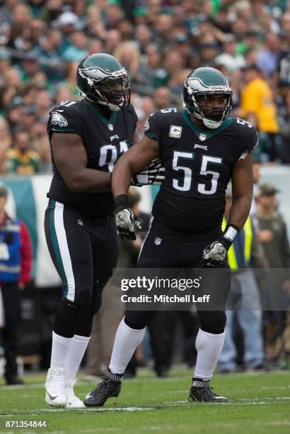 Fletcher Cox celebrates with Brandon Graham of the Philadelphia Eagles against the Denver Broncos at Lincoln Financial Field on November 5, 2017 in...