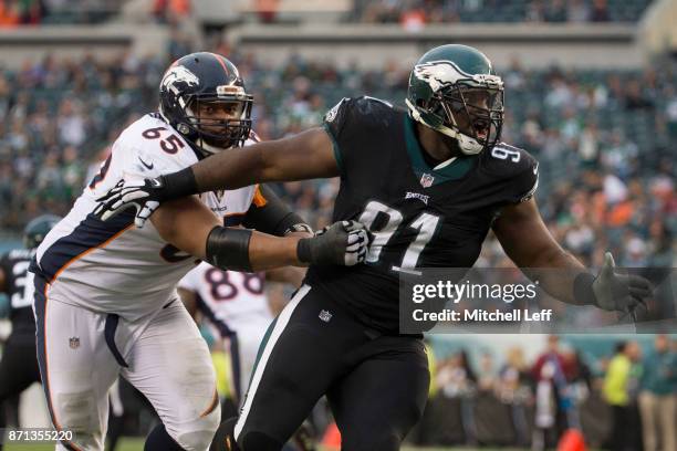 Fletcher Cox of the Philadelphia Eagles rushes the passer against Ronald Leary of the Denver Broncos at Lincoln Financial Field on November 5, 2017...