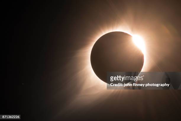 the diamond ring and the end of totality. - protuberanz stock-fotos und bilder