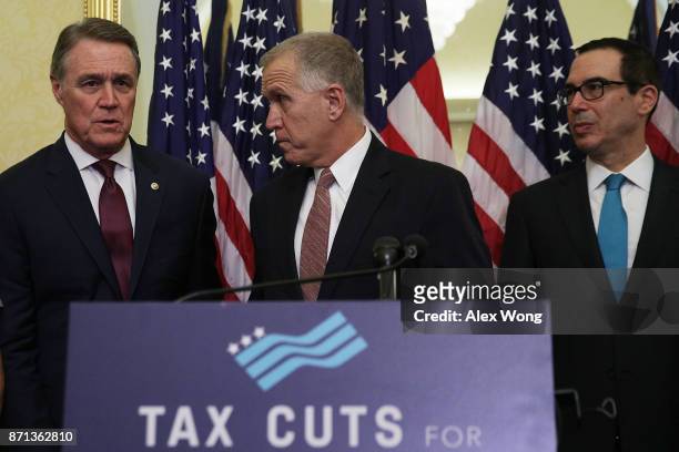 Sen. David Perdue , Sen. Thom Tillis , and Secretary of the Treasury Steven Mnuchin attend a news conference on tax reform November 7, 2017 on...