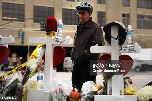 Mark Hennen looks at the eight crosses marking the location where terrorist Sayfullo Saipov entered a Manhattan bike path and went on a rampage with...