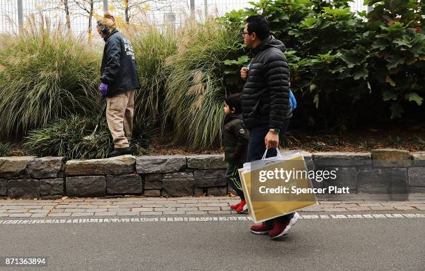 Members of the police department's crime scene unit search the location where terrorist Sayfullo Saipov drove down a Manhattan bike path and went on...